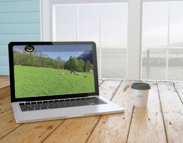 laptop with coffee showing web design website on screen near the window. 3d Rendering.